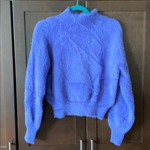 Slightly cropped purple fuzzy sweater